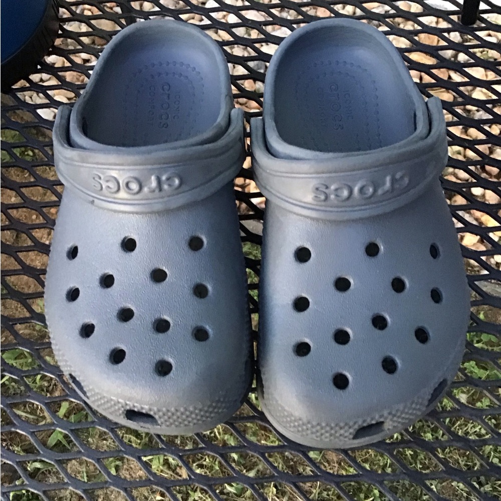 2 Pairs of Crocs. Gray and Black pair with Ventilation and Heel Strap